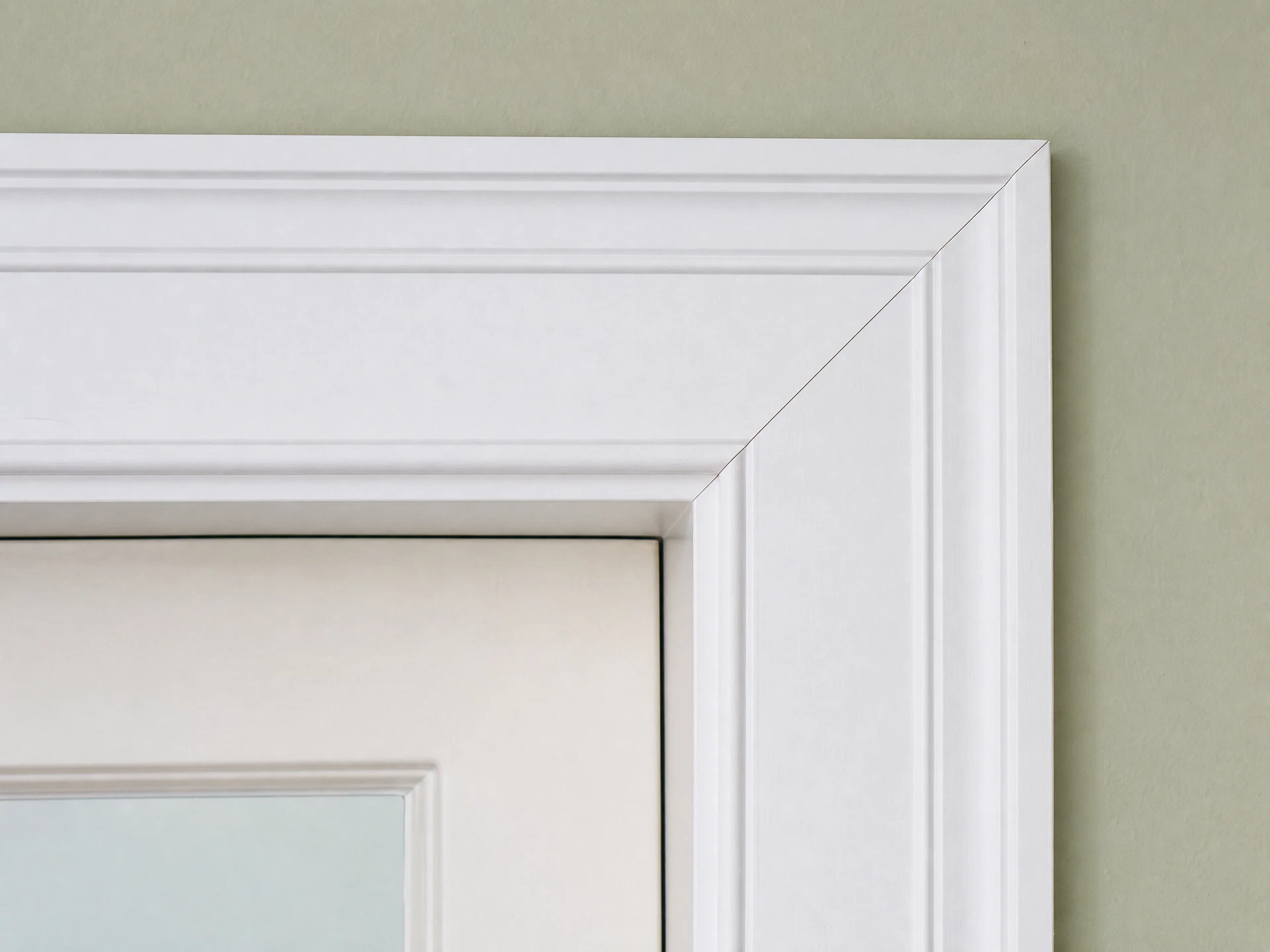 Precision miter joint at door casing corner — tight and gap-free